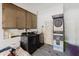 Inside the garage showcasing the dart machine and washer/dryer at 103 N Meteor Ave, Clearwater, FL 33765