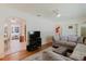 Spacious living room with hardwood floors and comfortable seating area at 103 N Meteor Ave, Clearwater, FL 33765