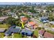 Aerial view showcasing the home's location, pool, landscaping, and proximity to Tampa Bay skyline at 111 Chesapeake Ave, Tampa, FL 33606
