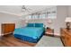 Cozy bedroom featuring shuttered windows, soft carpeting, and wood furnishings at 111 Chesapeake Ave, Tampa, FL 33606