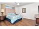 A simple bedroom featuring modern furnishings and hardwood floors at 111 Chesapeake Ave, Tampa, FL 33606
