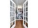 A spacious walk-in closet featuring hardwood floors and shelves at 111 Chesapeake Ave, Tampa, FL 33606