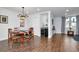 Open dining room with tile flooring, wine cooler, and neutral walls with modern decor at 111 Chesapeake Ave, Tampa, FL 33606