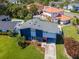 Aerial view of a modern two-story home with well-manicured lawn and stylish front yard landscaping at 111 Chesapeake Ave, Tampa, FL 33606