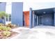 Modern facade showcasing a colorful exterior, mature landscaping, and covered parking at 111 Chesapeake Ave, Tampa, FL 33606