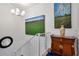 Staircase featuring white railings, paintings, and decor at 111 Chesapeake Ave, Tampa, FL 33606
