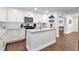 Stylish kitchen featuring white cabinets, granite countertops, stainless steel appliances, and a modern design at 111 Chesapeake Ave, Tampa, FL 33606