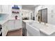 Updated kitchen features white cabinets, stainless appliances, granite countertops and breakfast bar at 111 Chesapeake Ave, Tampa, FL 33606