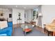 Bright living room with large window and neutral interior featuring tile floors and contemporary decor at 111 Chesapeake Ave, Tampa, FL 33606