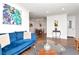Spacious living room showcasing decor, wood flooring, and an open layout to the dining area at 111 Chesapeake Ave, Tampa, FL 33606