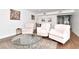 Spacious living room with tile floors, neutral walls, a contemporary rug, and glass table at 111 Chesapeake Ave, Tampa, FL 33606