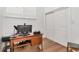 A simple bedroom with a desk, chair, and a closet at 111 Chesapeake Ave, Tampa, FL 33606