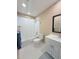 This is a renovated bathroom with white tile, a bathtub and shower, and new cabinets at 11764 Raintree Dr # 0, Temple Terrace, FL 33617
