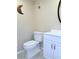 Clean bathroom featuring a toilet, vanity with modern fixtures, and neutral color scheme at 11764 Raintree Dr # 0, Temple Terrace, FL 33617