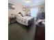 Bedroom with a vintage quilt, wood furniture and dark green carpet at 11764 Raintree Dr # 0, Temple Terrace, FL 33617