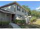 Well-maintained two-story home with manicured landscaping and a welcoming walkway at 11764 Raintree Dr # 0, Temple Terrace, FL 33617