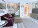 Comfortable living room showing staircase, a view of the hallway, and stylish decor at 11764 Raintree Dr # 0, Temple Terrace, FL 33617