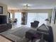 Spacious living area with a seamless transition to the dining space and plenty of natural light at 11764 Raintree Dr # 0, Temple Terrace, FL 33617