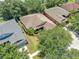 An aerial view of the residence shows the beautiful landscaping and well-maintained lawn at 11808 Holly Crest Ln, Riverview, FL 33569