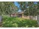 Spacious backyard showcases a well-maintained lawn, privacy fence, and ample space for recreation and entertaining at 11808 Holly Crest Ln, Riverview, FL 33569