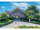 Community clubhouse at Rivercrest has well-maintained landscaping and a welcoming brick walkway at 11808 Holly Crest Ln, Riverview, FL 33569