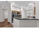 Kitchen area featuring stainless steel appliances, a breakfast bar, and a view of the entryway at 11808 Holly Crest Ln, Riverview, FL 33569