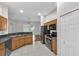 Functional kitchen featuring stainless steel appliances, a breakfast bar, and tiled flooring at 11808 Holly Crest Ln, Riverview, FL 33569