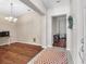 Open-concept living room featuring hardwood floors, neutral paint, and ample natural light at 11808 Holly Crest Ln, Riverview, FL 33569