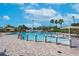 Beautiful community pool surrounded by well-maintained brick paving, lounge chairs, and shaded cabanas at 11808 Holly Crest Ln, Riverview, FL 33569