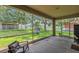 View from the screened-in patio looking out on the lush backyard and play area at 11808 Holly Crest Ln, Riverview, FL 33569