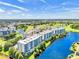 Scenic aerial shot of waterfront condos with beautiful trees and blue skies at 1200 Country Club Dr # 6302, Largo, FL 33771