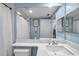 Clean bathroom featuring a mirror, toilet, and shower with a white shower curtain at 1200 Country Club Dr # 6302, Largo, FL 33771