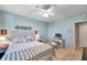 Comfortable bedroom featuring a full sized bed and a dedicated workspace with computer at 1200 Country Club Dr # 6302, Largo, FL 33771