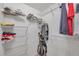 Spacious walk-in closet with custom shelving providing ample storage for clothes and accessories at 1200 Country Club Dr # 6302, Largo, FL 33771
