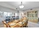 Elegant dining room featuring a rustic wooden table, seating for six, and a stylish china cabinet at 1200 Country Club Dr # 6302, Largo, FL 33771