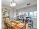 A dining room table with kitchen and bar stool seating in the background at 1200 Country Club Dr # 6302, Largo, FL 33771