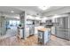 Bright kitchen with stainless steel appliances, granite countertops, and a convenient center island at 1200 Country Club Dr # 6302, Largo, FL 33771