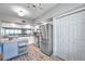 Modern kitchen featuring stainless steel appliances, granite countertops, and ample cabinet space at 1200 Country Club Dr # 6302, Largo, FL 33771