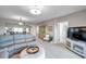 Cozy living room features plush seating, stylish decor, and an open layout to the kitchen and dining area at 1200 Country Club Dr # 6302, Largo, FL 33771
