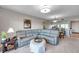 Comfortable living room area featuring a large sectional sofa and access to the dining area at 1200 Country Club Dr # 6302, Largo, FL 33771