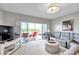 Comfortable living room with plush seating and sliding glass doors to the screened lanai at 1200 Country Club Dr # 6302, Largo, FL 33771