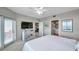 Spacious bedroom featuring a sliding glass door, closet, and en-suite bathroom at 1200 Country Club Dr # 6302, Largo, FL 33771