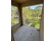 Screened balcony with a metal railing offers views of the lush green outdoor space at 12631 Silverdale St, Tampa, FL 33626