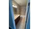 Cozy bathroom featuring a single vanity and shower-tub combination at 12631 Silverdale St, Tampa, FL 33626