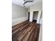 Bright bedroom with ceiling fan, wood-style flooring, and spacious closet at 12631 Silverdale St, Tampa, FL 33626