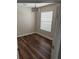 Bedroom featuring hardwood floors, neutral paint, and a bright window at 12631 Silverdale St, Tampa, FL 33626
