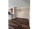 Open dining area with wood flooring and modern chandelier, adjacent to the kitchen at 12631 Silverdale St, Tampa, FL 33626