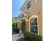 Close-up of the home's exterior featuring architectural details and manicured shrubs at 12631 Silverdale St, Tampa, FL 33626
