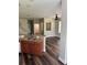 Open concept kitchen with breakfast bar, stainless steel appliances, and wood flooring at 12631 Silverdale St, Tampa, FL 33626
