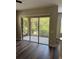Living area with sliding glass doors leading to a screened patio and serene outdoor views at 12631 Silverdale St, Tampa, FL 33626